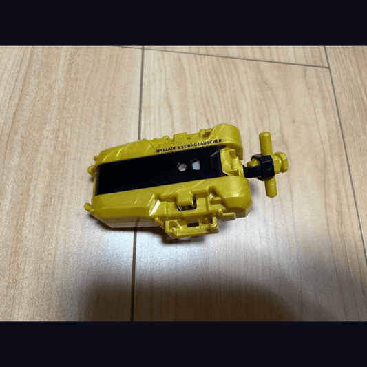 Beyblade X G2 Tournament Winner Prize — String Launcher Gold